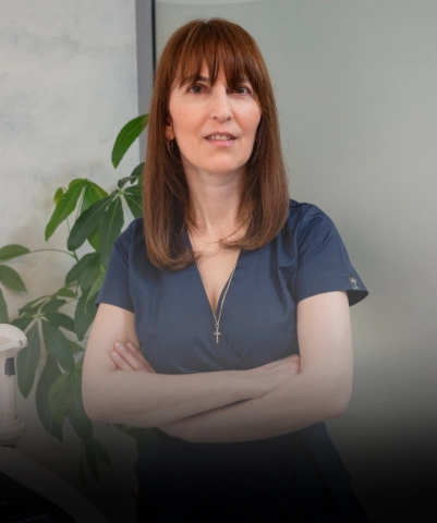 Board certified team member in white uniform.